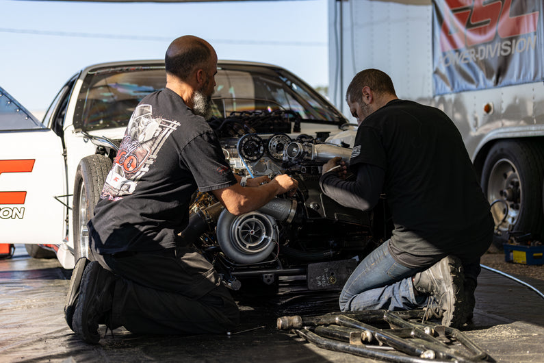 Engine builders working on a performance engine in official GSC Power-Division workshop photography